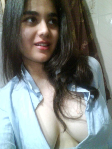Indian girl takes self shots with big natural tits free of blouse